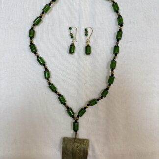 Glass bead with brass pendant set